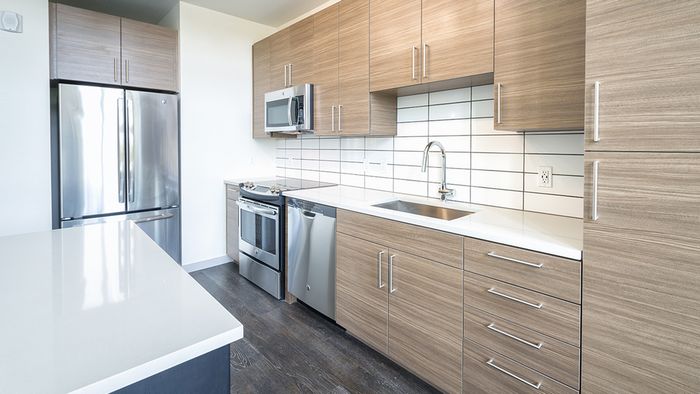 Stainless Steel and Custom Cabinets in our Studio Apartment Homes
