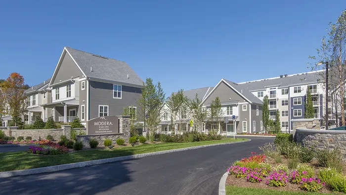 Exterior Drive Up To Leasing Office at Modera Needham with Beautiful Landscaping