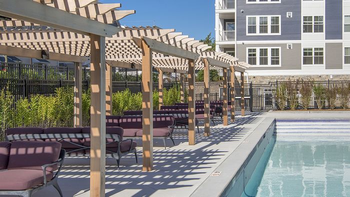 Partially Shaded Sun Deck and Salt Water Pool at Modera Needham Apartments