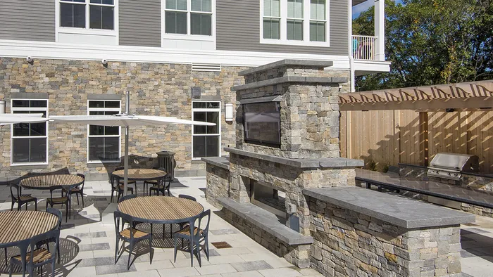 Outdoor Deck, Private Dining and BBQ Area at Modera Needham Apartments