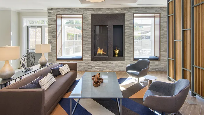 Expansive clubhouse with coffee bar at Modera Needham Apartments