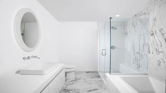 Spa-inspired bathrooms featuring floor to ceiling marble for bath and shower