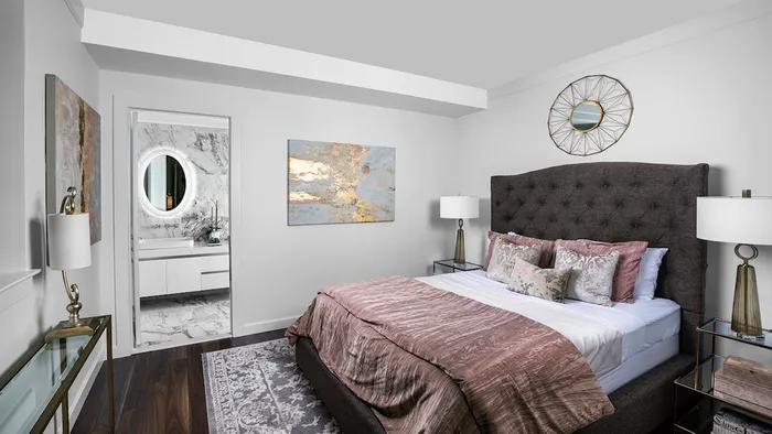 Well appointed bedroom with wood flooring throughout