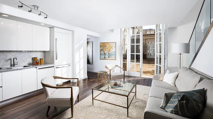 Open concept living area and kitchen with fully appointed appliances