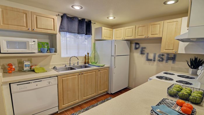 Open Concept Kitchen with White Appliances and Recessed Lighting