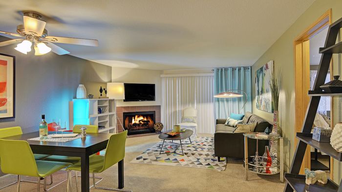 Living Room with Wood-Burning Fireplace and Large Sliding Glass Doors