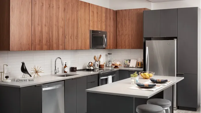 Open concept kitchen with stainless steel appliance package