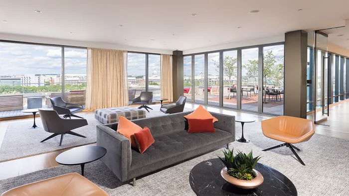 Resident lounge with wall of floor to ceiling windows
