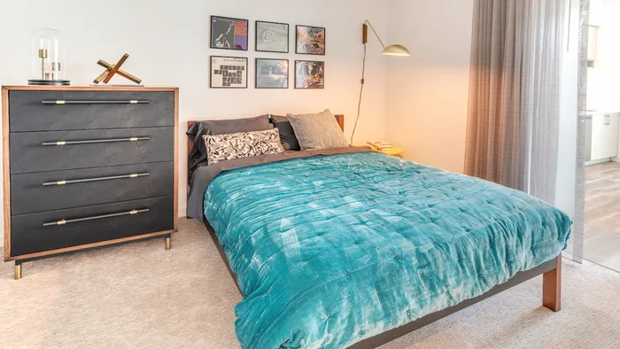 Master Bedroom with Bed and Large Dresser