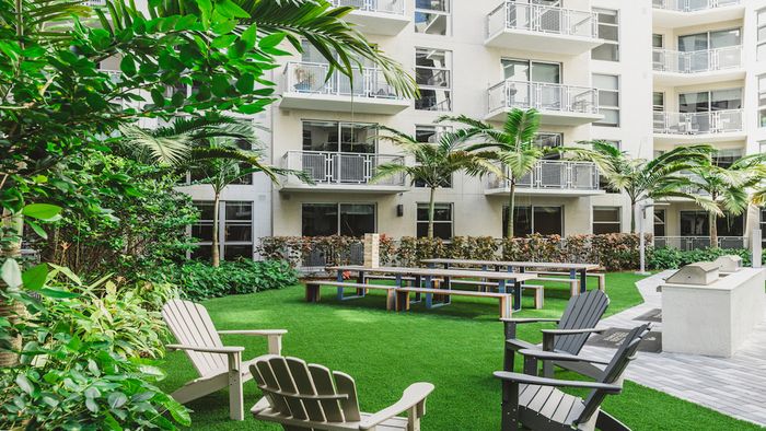 Serene courtyard with grilling stations and dining areas