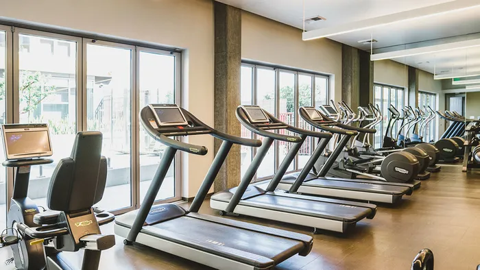 Expansive fitness center with Technogym&reg; strength and cardio equipment