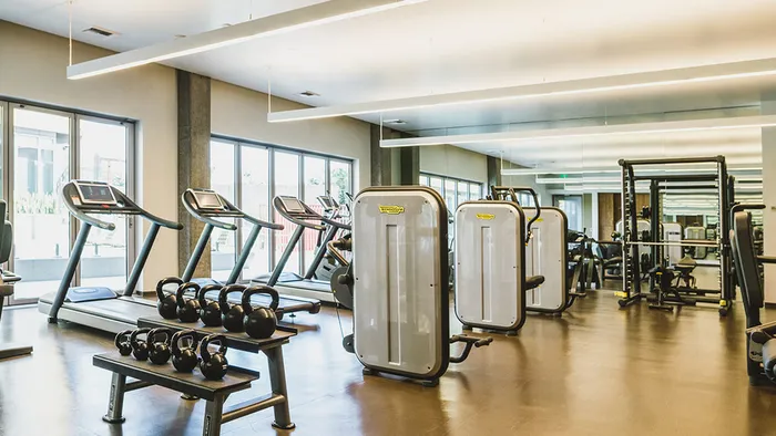 Expansive fitness center with Technogym&reg; strength and cardio equipment