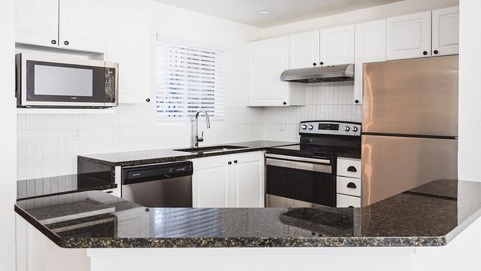 Well appointed and brightly lit open concept kitchen