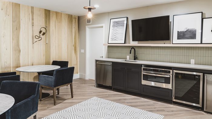 Reimagined clubroom with seating and kitchen area