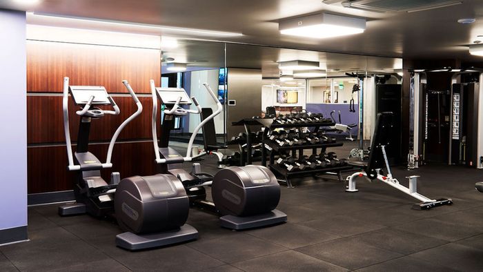 Ellipticals, free-weights and weight stations at Modera Rincon Hill apartments.