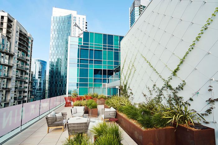 Rooftop terrace with green spaces at Modera Rincon Hill apartments.