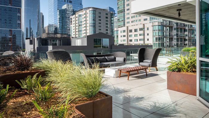Outdoor lounge area and gathering spaces at Modera Rincon Hill apartments.