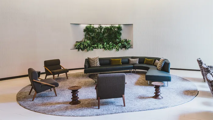 Resident lounge with curve sofa and lounge chairs