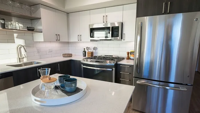 Kitchen with island and bi-color cabinets