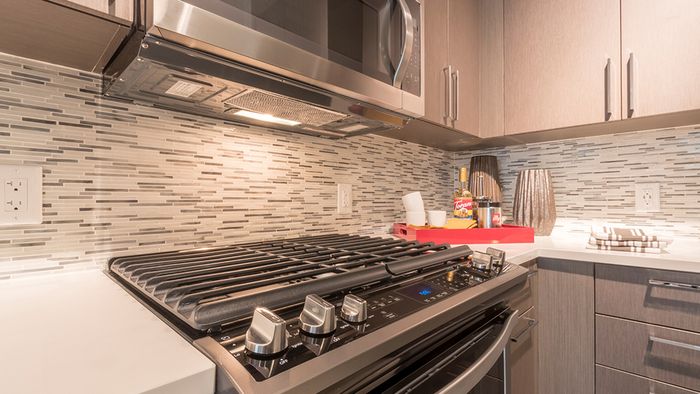 Tile Backsplash, Gas Cooktop and USB Ports in Kitchen