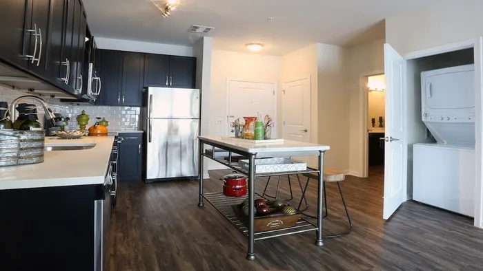 Open Kitchen with Full-Size Stackable Washer and Dryer in Closet