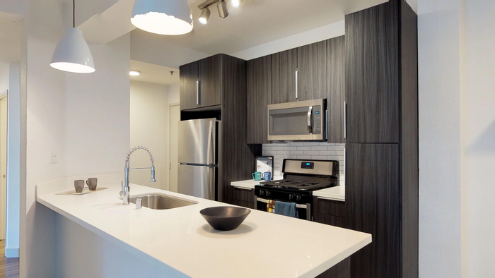 Modern kitchen with dark and light cabinetry