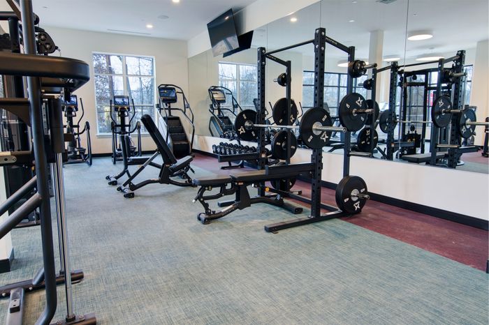 Club-quality fitness studio with group fitness area at modera berkeley heights apartments in new jersey