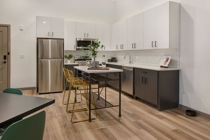 Modern white and grey two-tone cabinets at modera berkeley heights apartments in new jersey