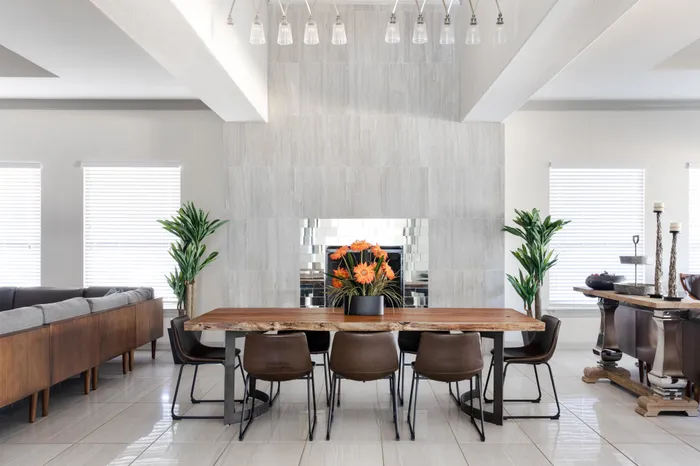 table and seating with premium finishes at alister oak hill apartments austin texas