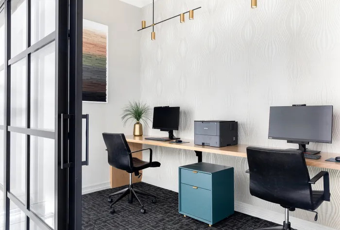 computer in office space at alister oak hill apartments austin texas
