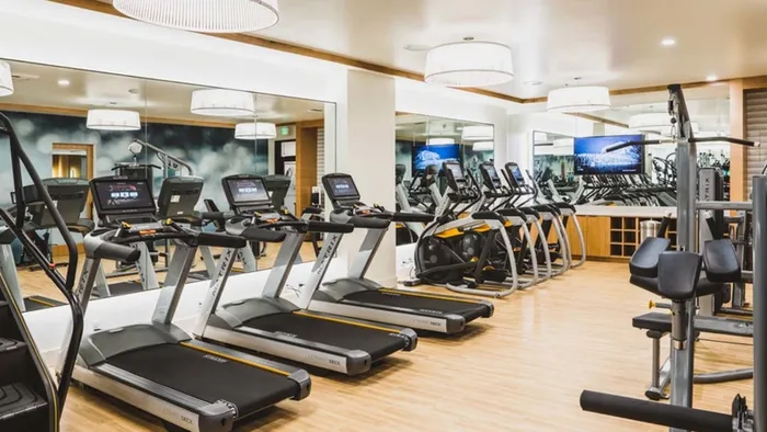 Cardio equipment includes treadmills, ellipticals and stair climbers at Modera Broadway apartments.