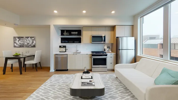 Spacious studio homes with built in shelves and galley kitchens at Modera Broadway Apartments