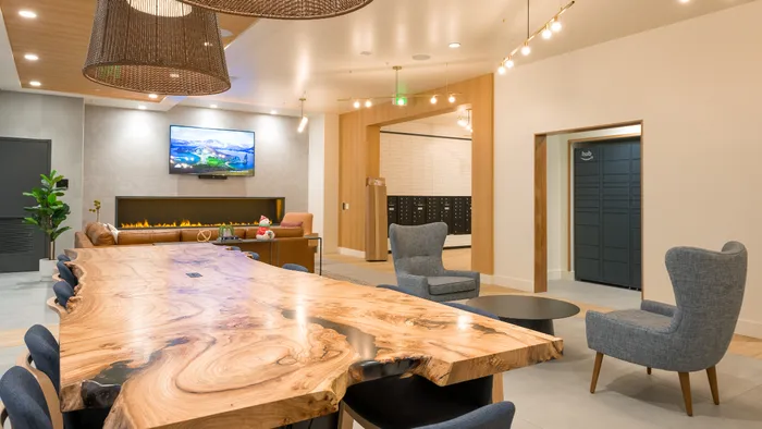Lounge with work from home conference table  at Modera Broadway apartments in Seattle.