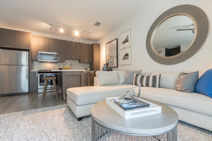 large living room looking onto kitchen at Modera Midtown apartment homes in atlanta georgia