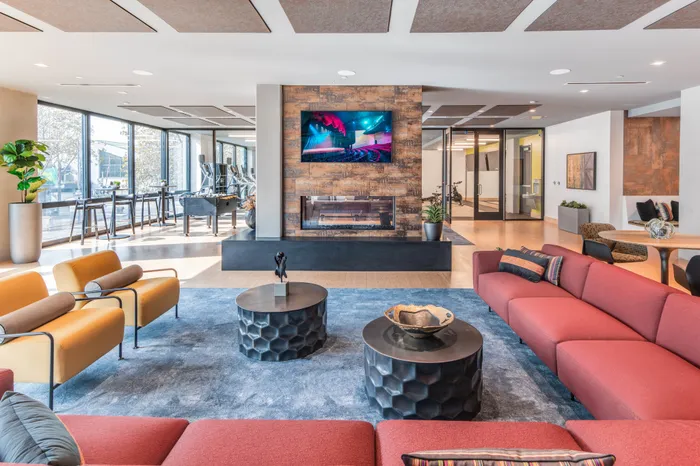 resident lounge with ample seating and hdtv at modera jack london square apartment homes for rent in oakland california