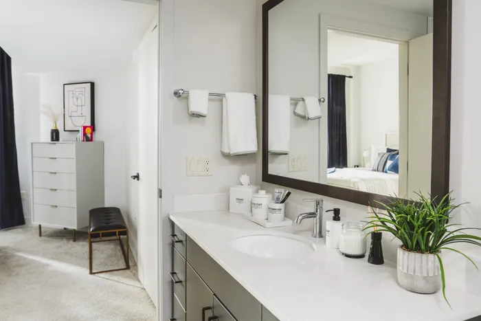 kitchen vanity with large mirror at modera decatur apartment homes for rent in georgia
