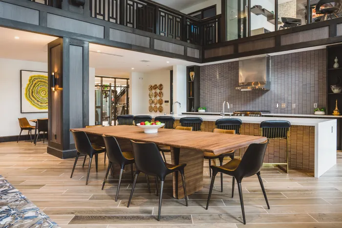 large dining table near the demonstration kitchen at modera decatur apartment homes for rent in georgia