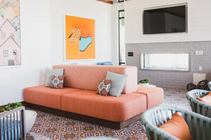 comfortable seating with large tv in resident amenity space at modera decatur apartment homes for rent in georgia
