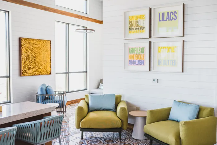 open and airy resident amenity space with comfortable seating at modera decatur apartment homes for rent in georgia