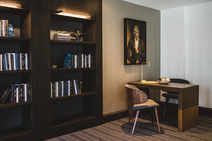 co-working space and bookshelves at modera decatur apartment homes for rent in georgia