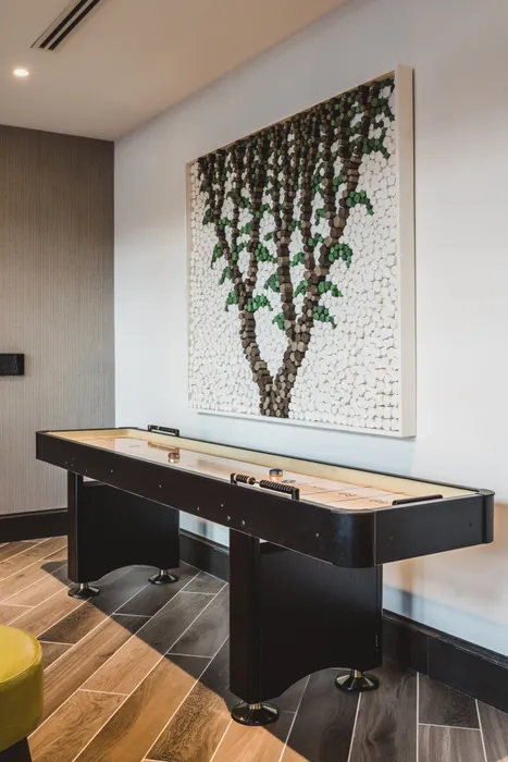 shuffleboard in game room at modera decatur apartment homes for rent in georgia