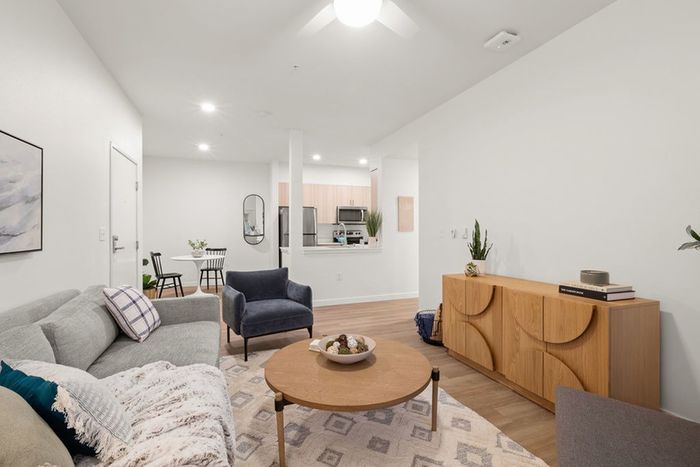 Model living room with large couch and seating area