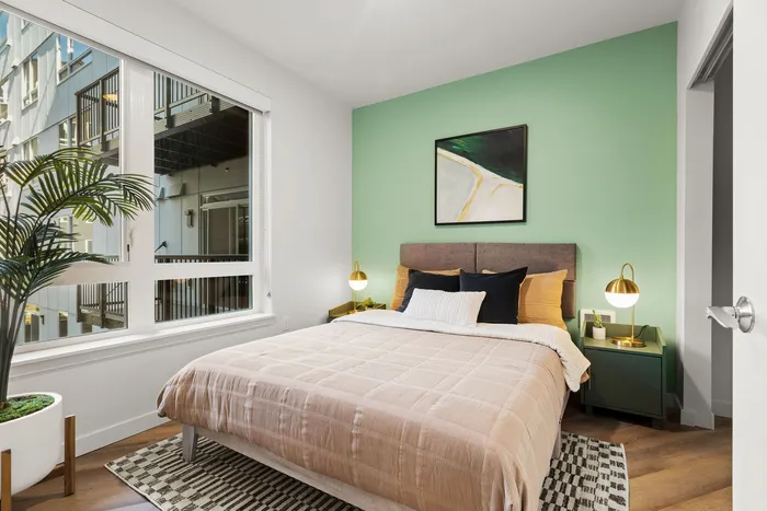 Bedroom area with large windows and tons of natural light