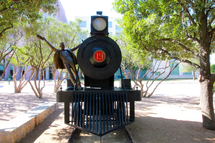 frisco's first statue of person on train in frisco texas