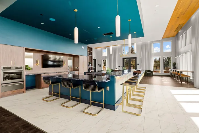 Bar stool seating around spacious community kitchen space