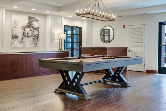 resident pool table in community room at Alister Montclair