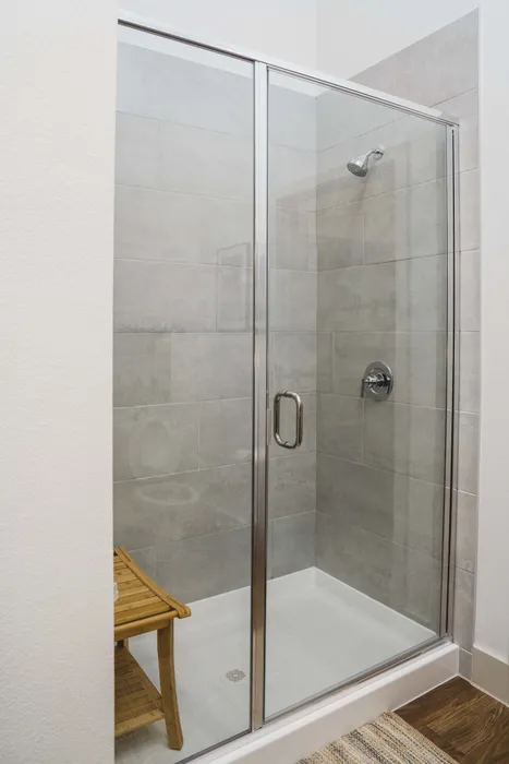 step-in glass showers in a Modera Frisco Square apartment