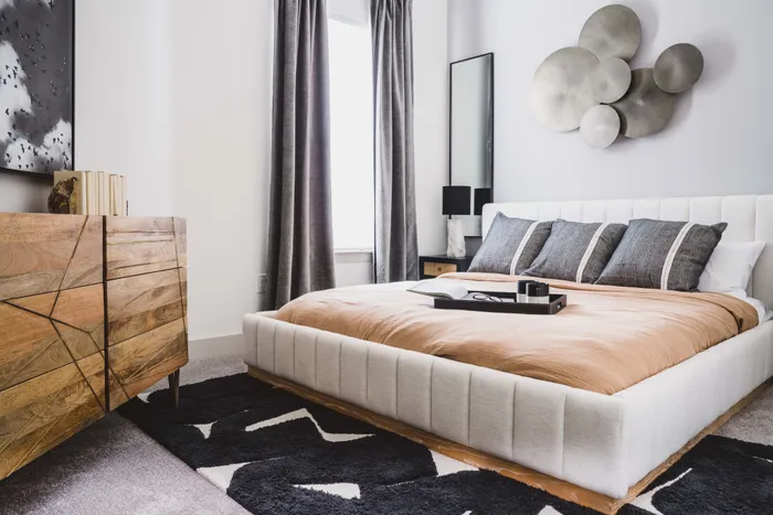 spacious bedroom with large windows for plenty of natural light in a Modera Frisco Square apartment