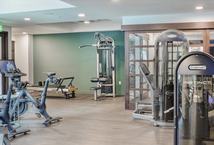 fitness center with TRX and cardio equipment