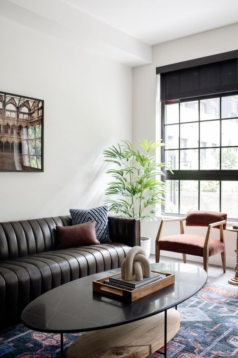 living room with couch and large window modera art park apartment homes for rent in denver colorado